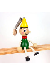 Holzfigur Pinochio baumelnd
